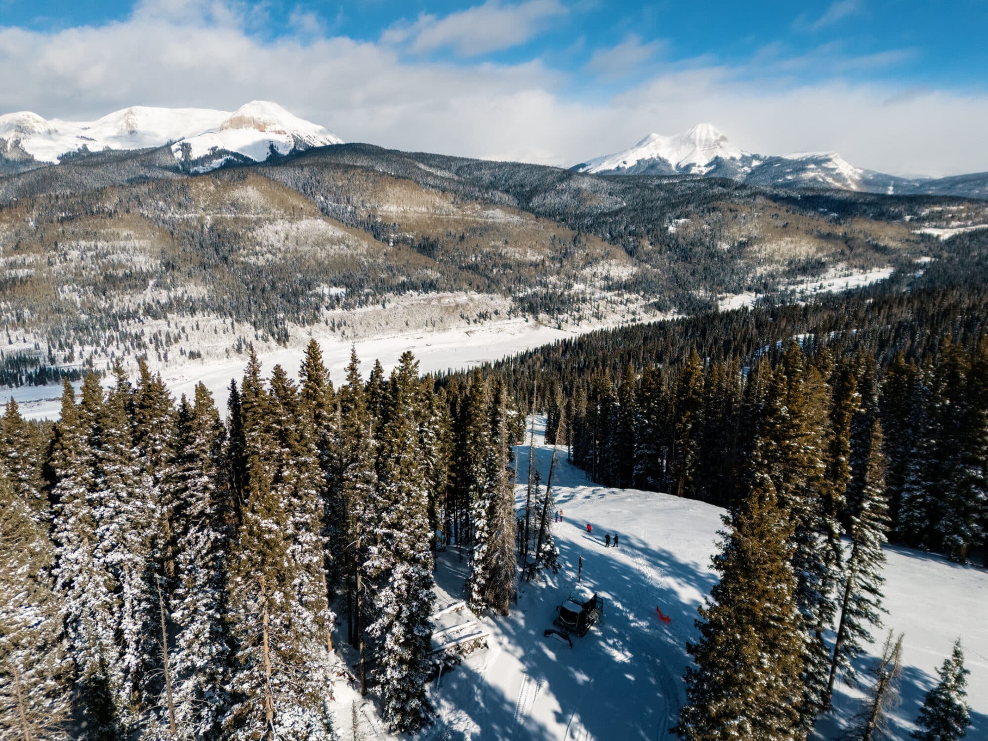 Drone image of scenic snowcat take guests to scenic overlook