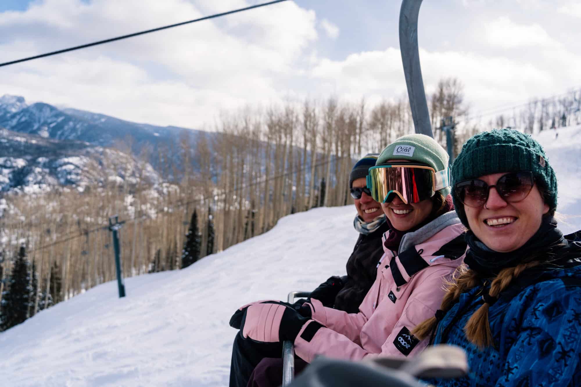 Family rides the lift down after a scenic snowcat tour