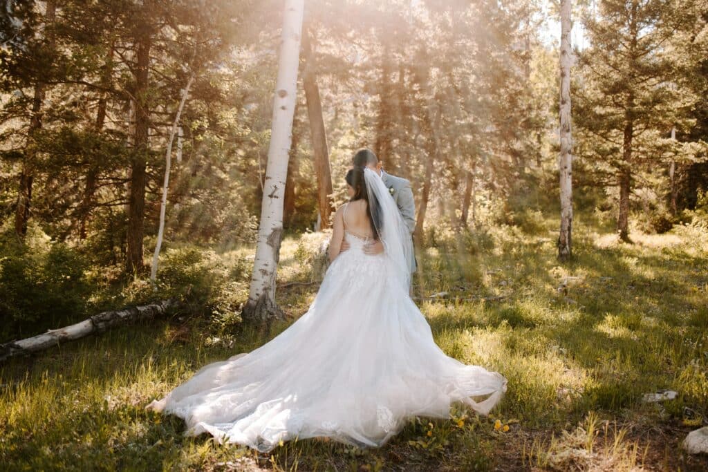 Bride and groom first look with sun shining on them