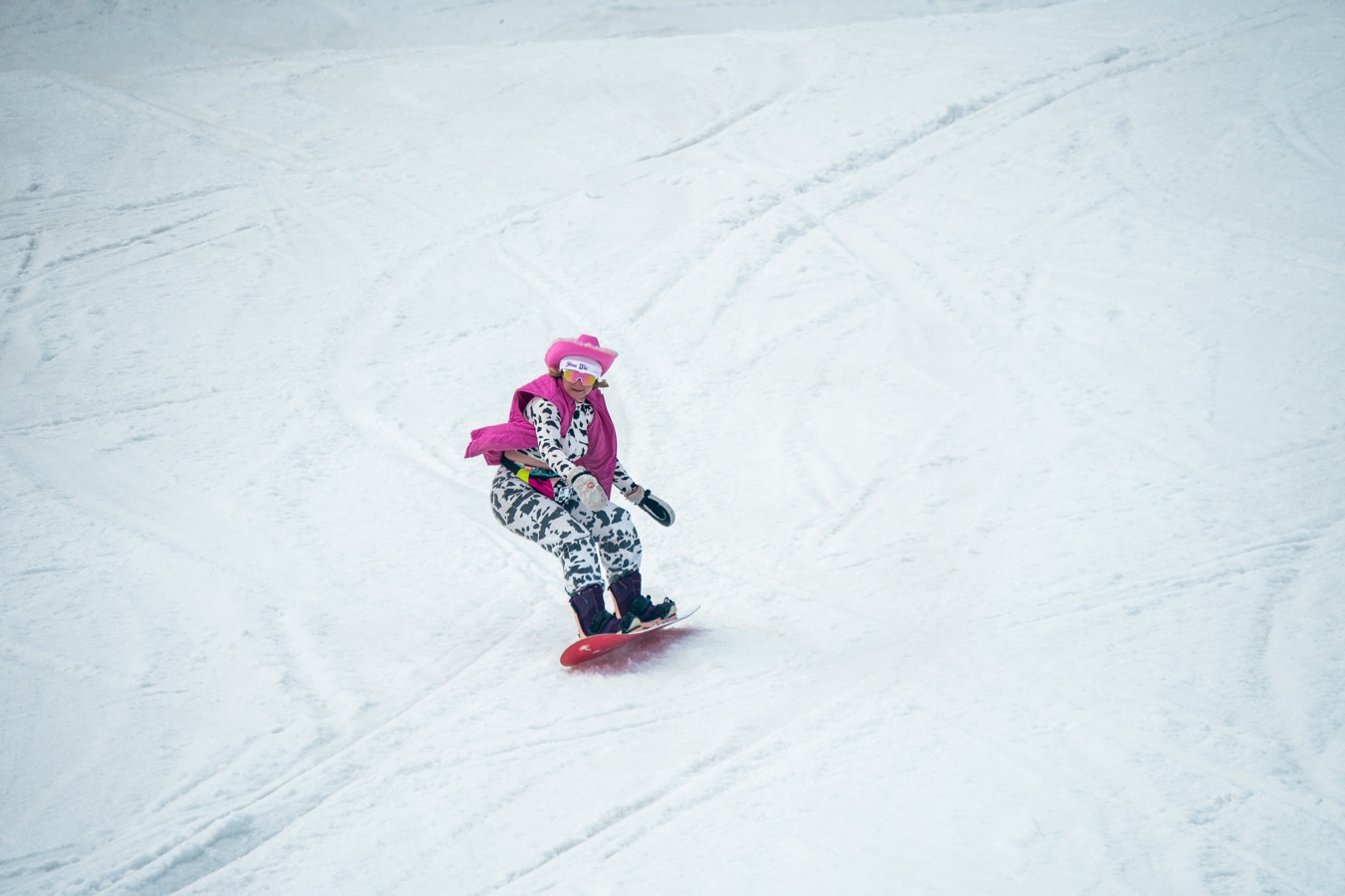 Snowboarder dressed up in a fun costume enjoys some spring turns at Purgatory Resort