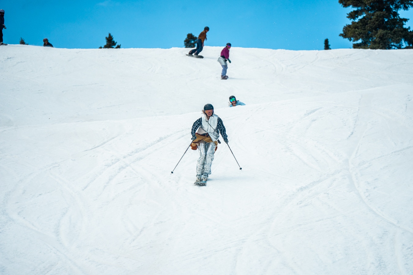 Group of people dressed in costumes enjoy some spring skiing turns at Purgatory Resort